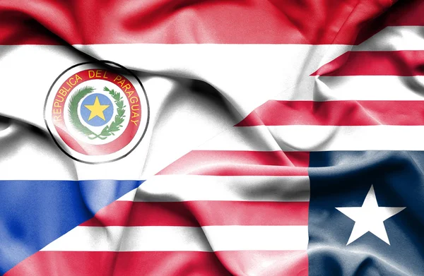 Wapperende vlag van liberia en paraguay — Stockfoto