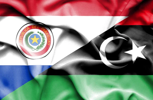 Bandera ondeante de Libia y Paraguay — Foto de Stock