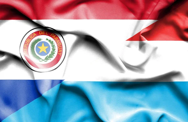 Waving flag of Luxembourg and Paraguay — Stock Photo, Image