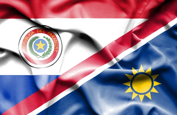 Wapperende vlag van Namibië en paraguay — Stockfoto