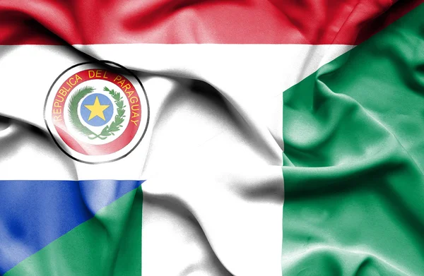 Wapperende vlag van nigeria en paraguay — Stockfoto