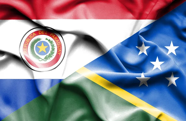 Wapperende vlag van Salomonseilanden en paraguay — Stockfoto