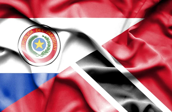 Waving flag of Trinidad and Tobago and Paraguay — Stock Photo, Image