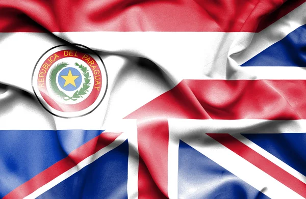 Bandera ondeante de Reino Unido y Paraguay — Foto de Stock