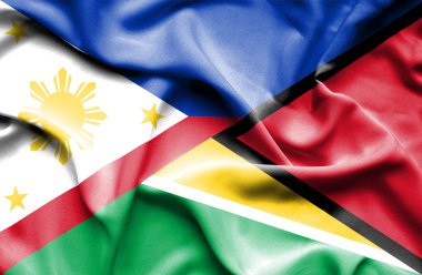 guyana ve Filipinler bayrağı sallayarak