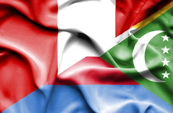 Komor Adaları ve peru bayrağı sallayarak — Stok fotoğraf