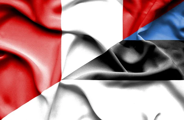 エストニアとペルーの旗を振っています。 — ストック写真