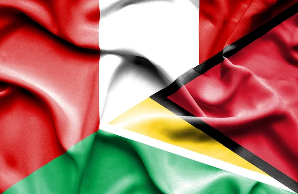 Waving flag of Guyana and Peru — Stock Photo, Image