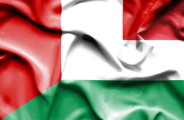 Waving flag of Hungary and Peru — Stock Photo, Image