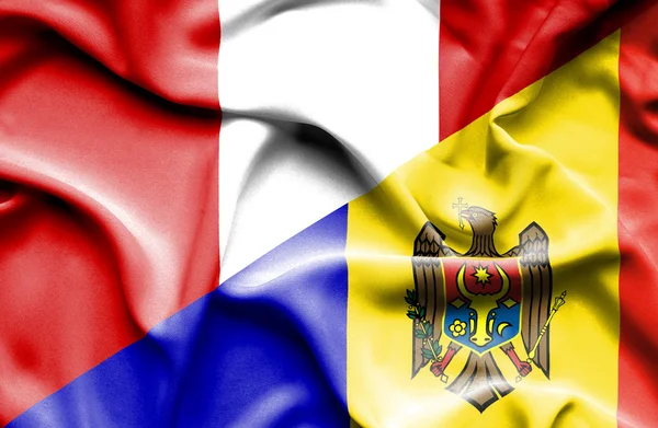 Waving flag of Moldavia and Peru — Stock Photo, Image