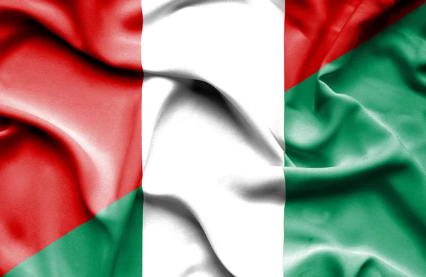 Waving flag of Nigeria and Peru — Stock Photo, Image