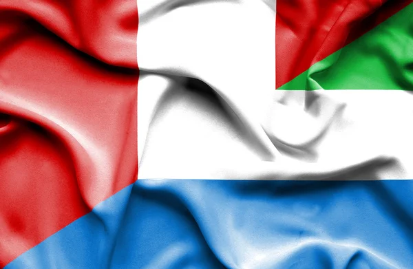 Bandeira acenando de Serra Leoa e Peru — Fotografia de Stock