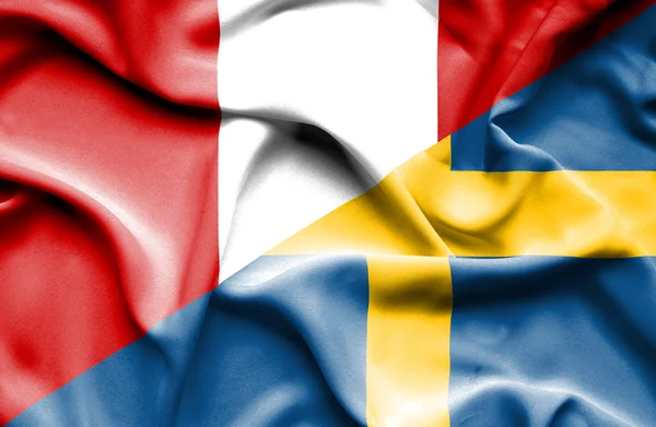 Waving flag of Sweden and Peru — Stock Photo, Image