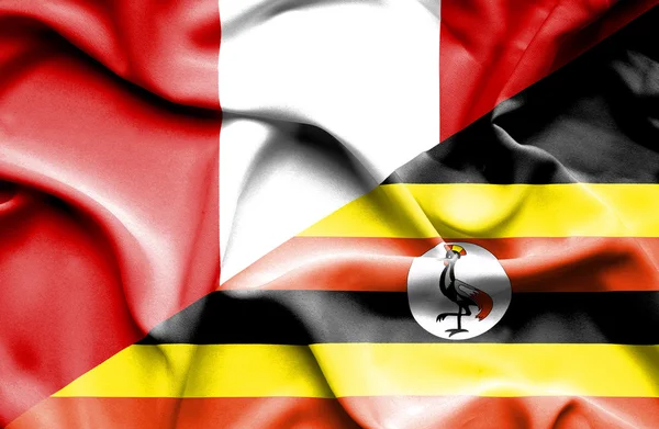 Ugandas og Perus flagg – stockfoto