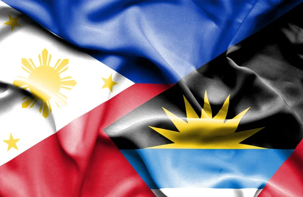 Wapperende vlag van antigua en barbuda en Filippijnen — Stockfoto