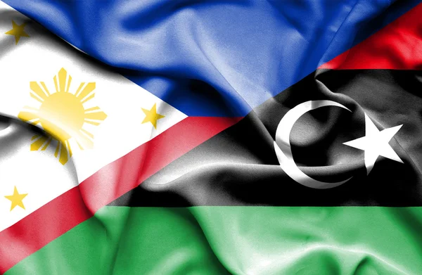 Vlající vlajka Libye a Filipíny — Stock fotografie