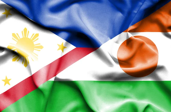 Wapperende vlag van niger en Filippijnen — Stockfoto