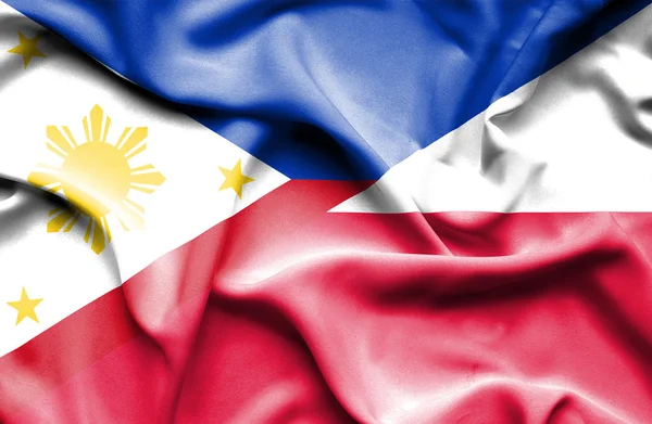 ポーランド、フィリピンの旗を振っています。 — ストック写真