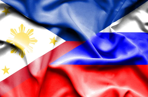 Ondeando la bandera de Rusia y Filipinas —  Fotos de Stock