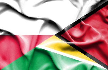 guyana ve Polonya bayrağı sallayarak