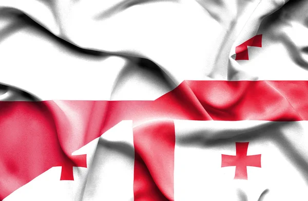 Waving flag of Georgia and Poland — Stock Photo, Image