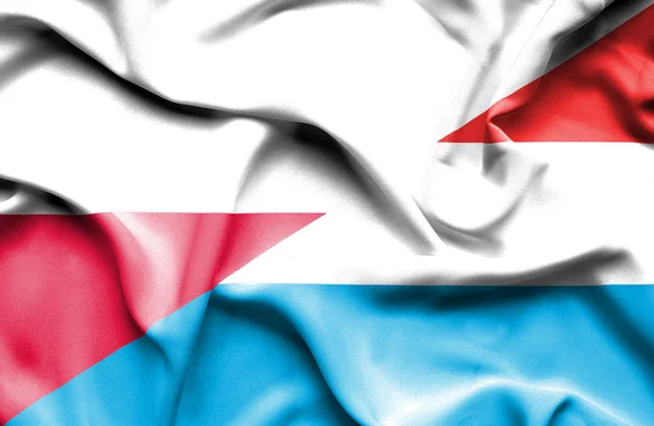 Waving flag of Luxembourg and Poland — Stock Photo, Image