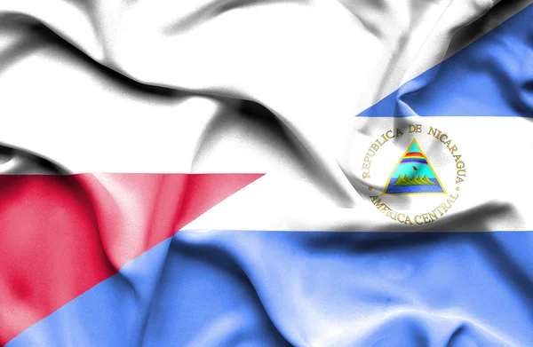 Wapperende vlag van nicaragua en Polen — Stockfoto