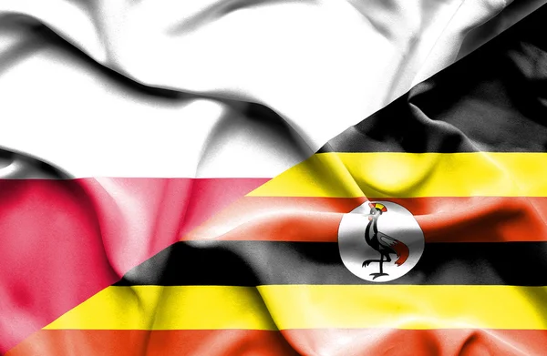 Bandera ondeante de Uganda y Polonia — Foto de Stock