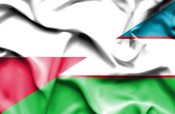 Bandera ondeante de Uzbekistán y Polonia —  Fotos de Stock