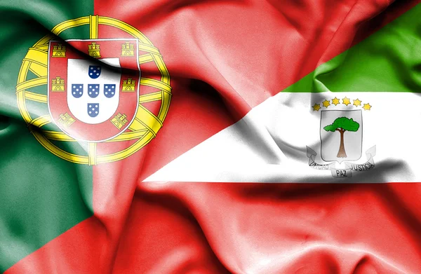 Wapperende vlag van Equatoriaal giuinea en portugal — Stockfoto