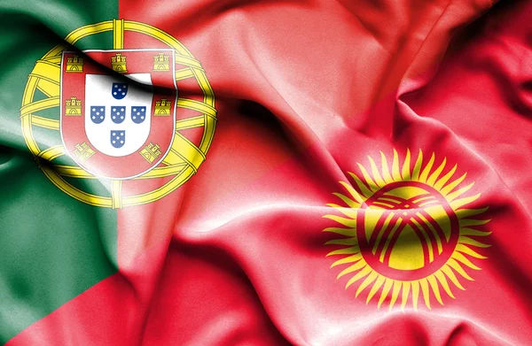 Viftande flagga Kirgizistan och portugal — Stockfoto