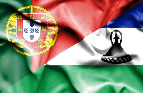 Viftande flagga lesotho och portugal — Stockfoto