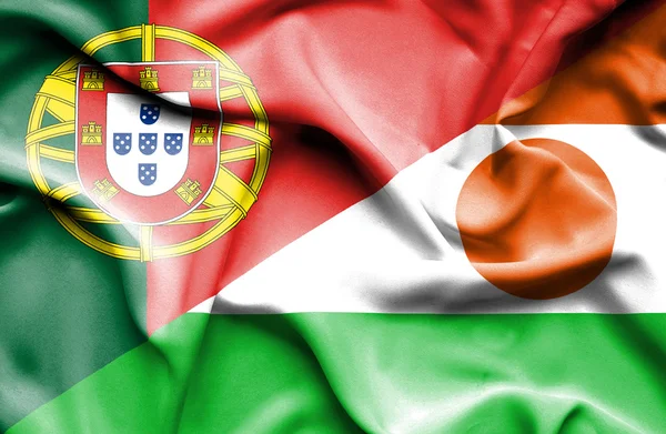 Waving flag of Niger and Portugal — Stock Photo, Image