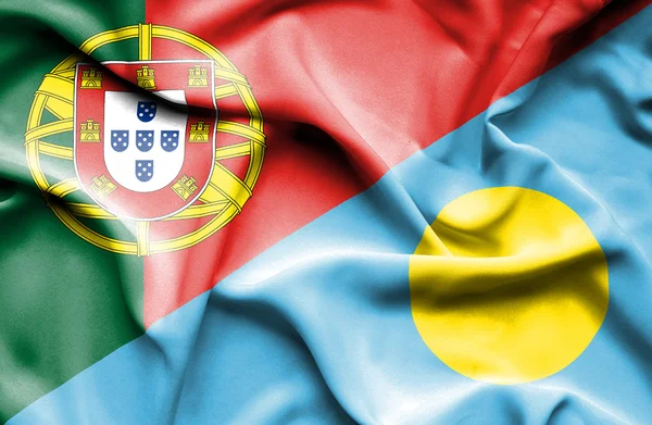 Wapperende vlag van palau en portugal — Stockfoto