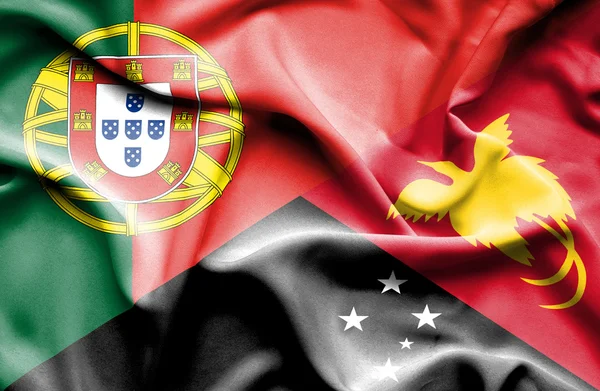 Mávání vlajkou Portugalska a Papua-Nová guinea — Stock fotografie