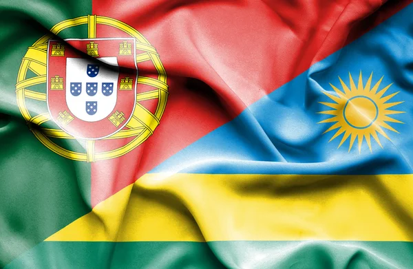 Waving flag of Rwanda and Portugal — Stock Photo, Image