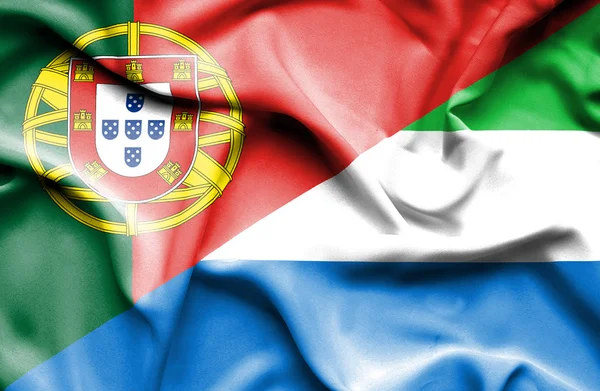 Wapperende vlag van sierra leone en portugal — Stockfoto