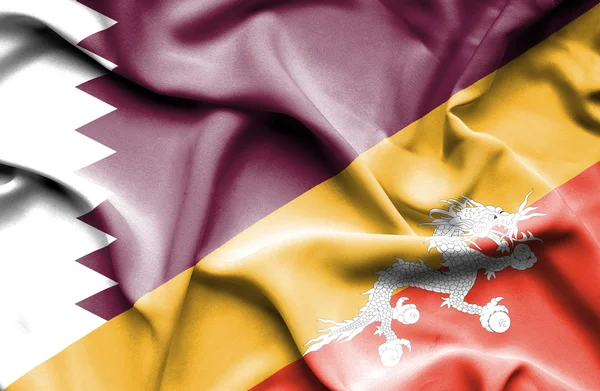 Lambaikan bendera Bhutan dan Qatar — Stok Foto