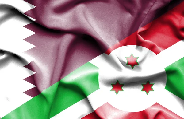 Ondeando la bandera de Burundi y Qatar — Foto de Stock
