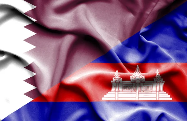 Waving flag of Cambodia and Qatar — Stock Photo, Image