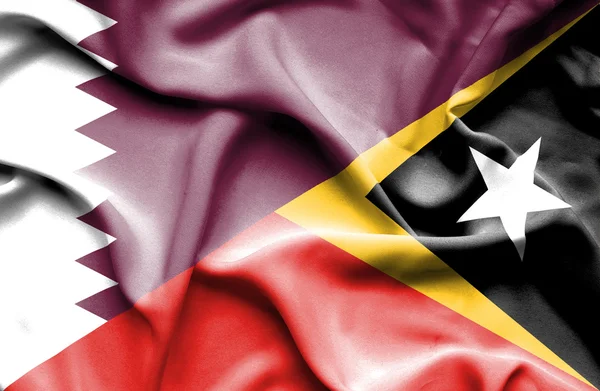 Lambaikan bendera Timor Leste dan Qatar — Stok Foto