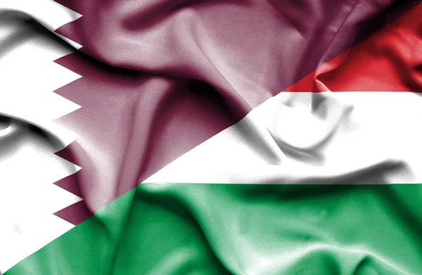 Wapperende vlag van Hongarije en qatar — Stockfoto