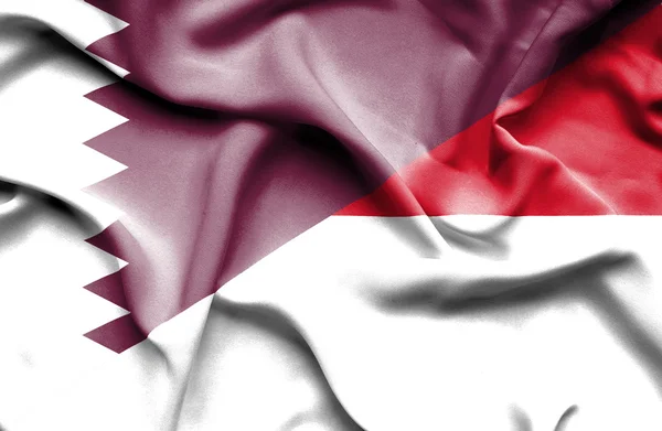 Waving flag of Monaco and Qatar — Stock Photo, Image