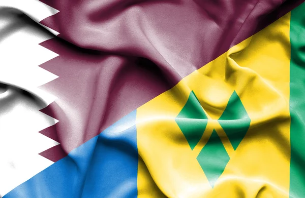 Waving flag of Saint Vincent and Grenadines and Qatar — Stock Photo, Image