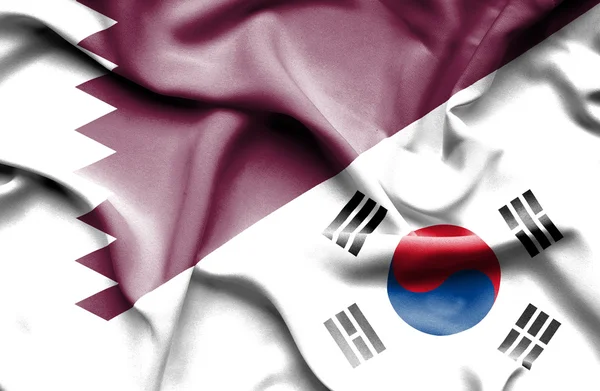 Flagge von Südkorea und Katar schwenkend — Stockfoto