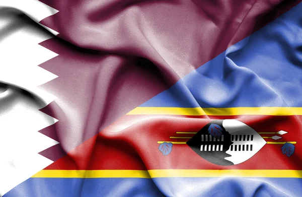 Swazliand och qatar viftande flagga — Stockfoto