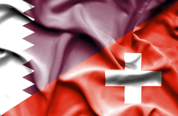 Ondeando la bandera de Suiza y Qatar —  Fotos de Stock