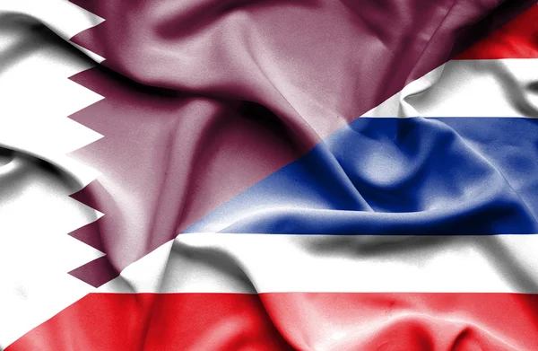 Thailand och qatar viftande flagga — Stockfoto