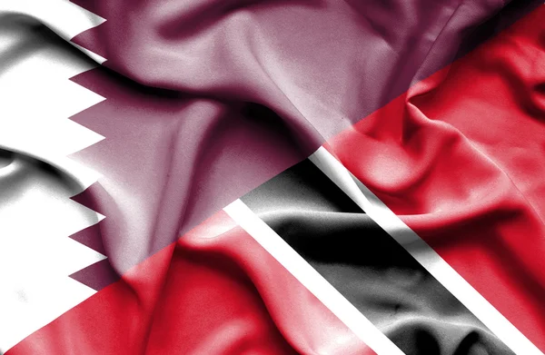 Waving flag of Trinidad and Tobago and Qatar — Stock Photo, Image