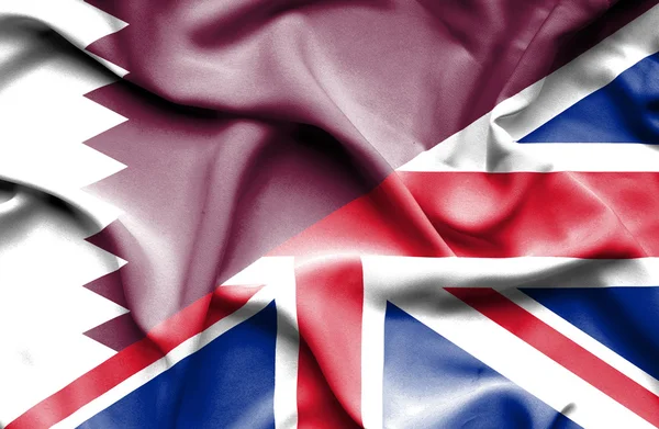 Bandeira acenando de Reino Unido e Qatar — Fotografia de Stock